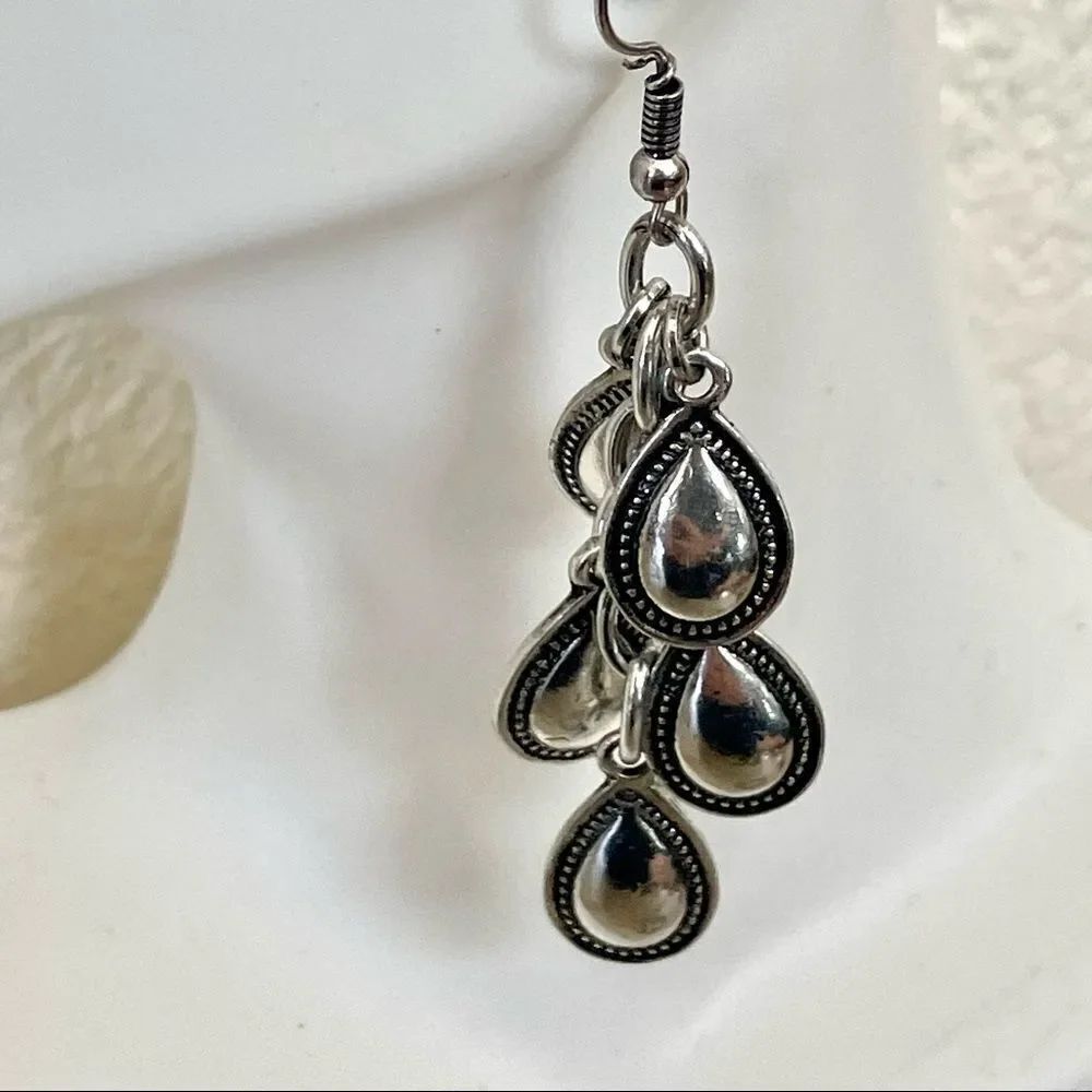 Silver tone teardrop charm earrings